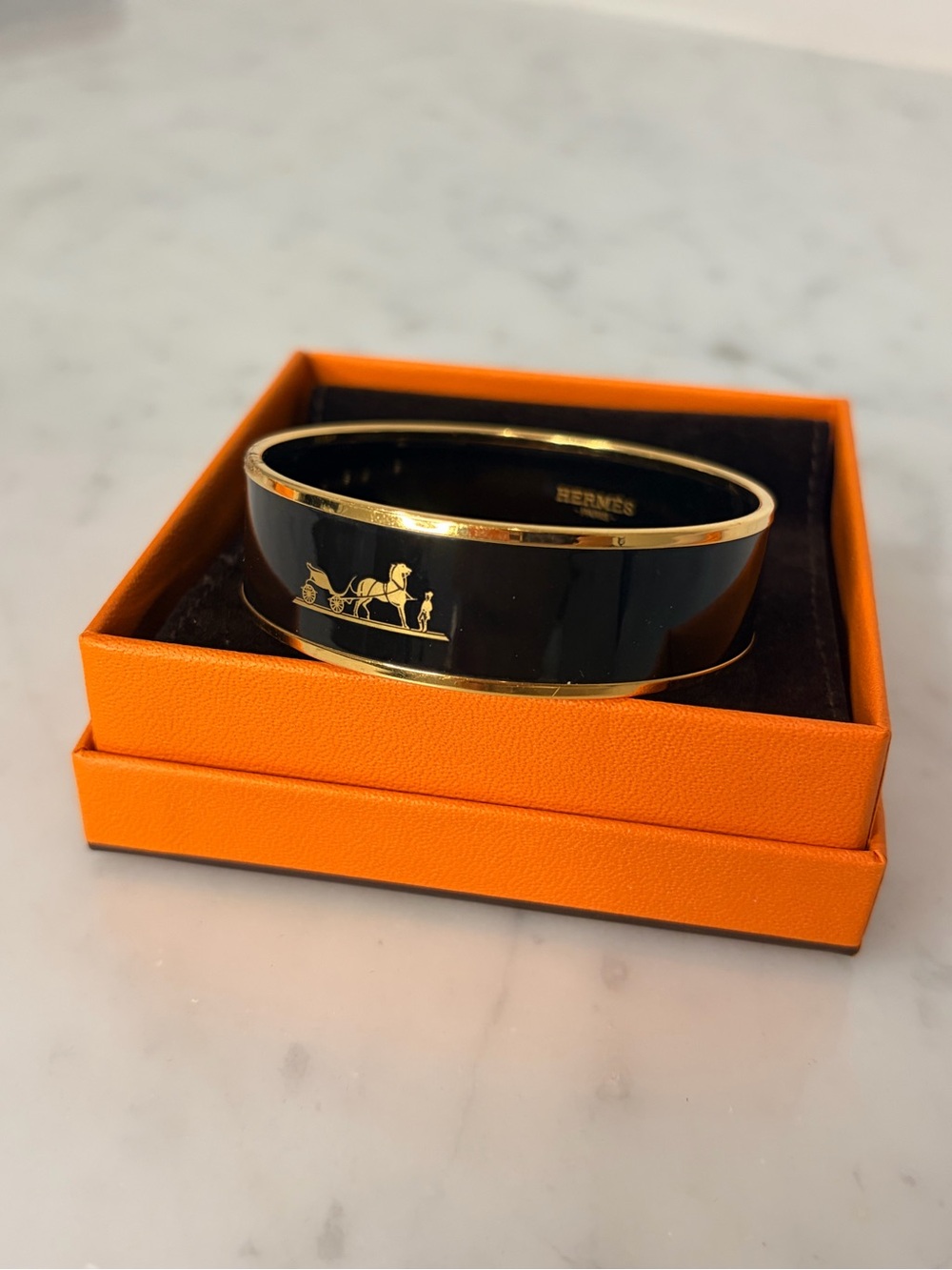 HERMES Caleche wide bangle in black and gold